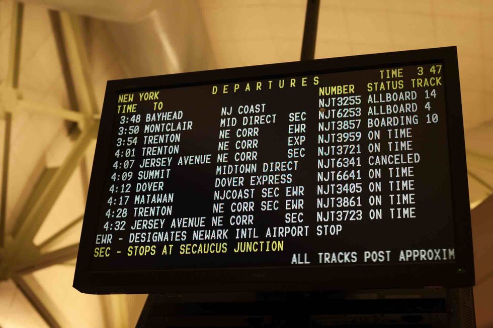 NJ Transit timetable board showing train schedule
