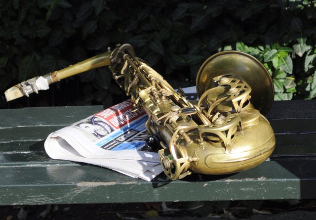 Brass horn and paper