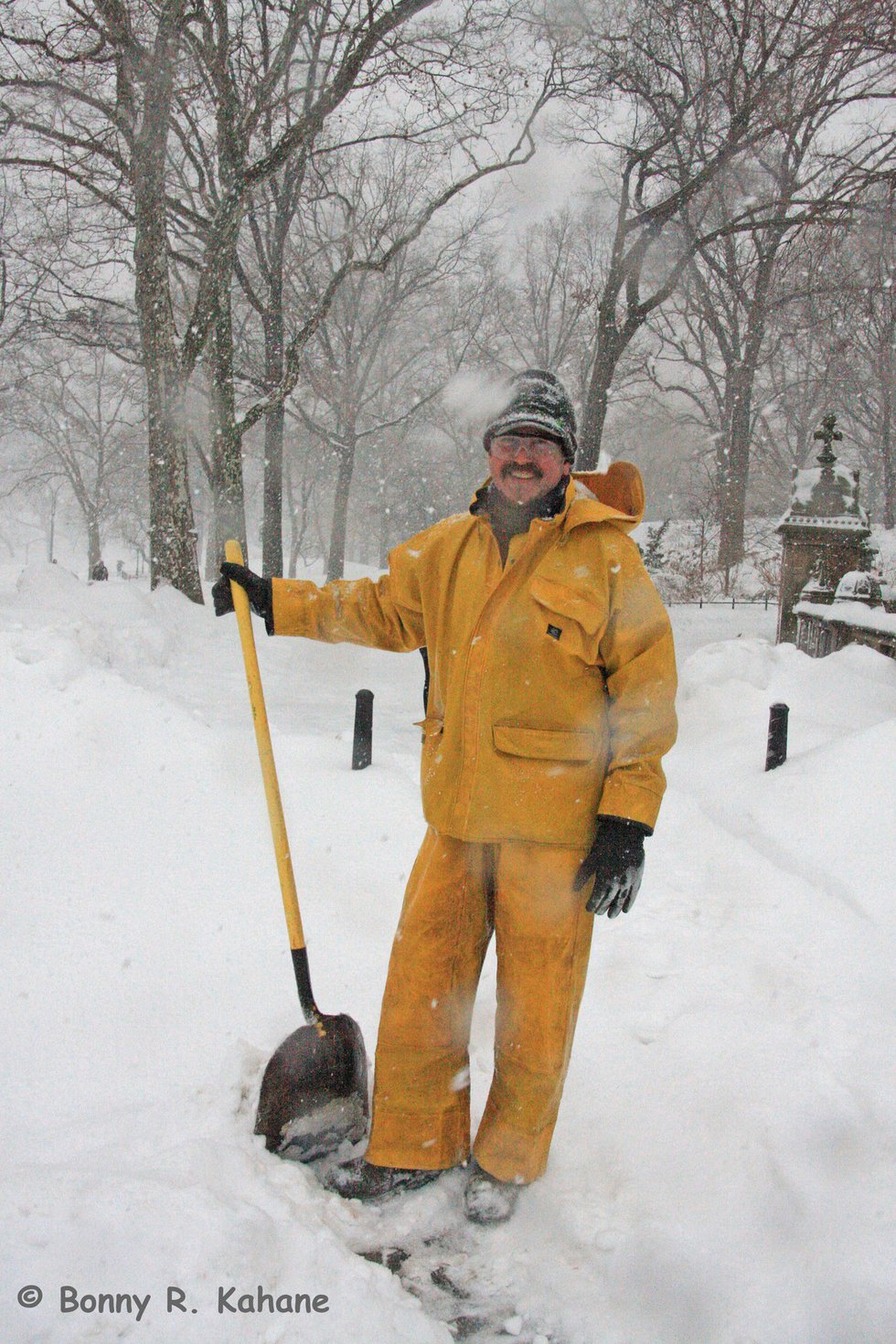 Harry shoveling as the snow falls